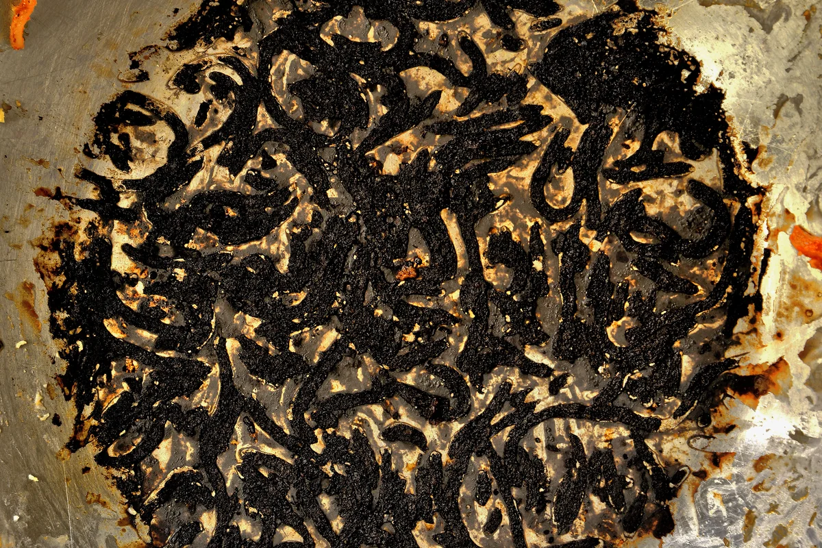 Burnt-on food residue in cookware